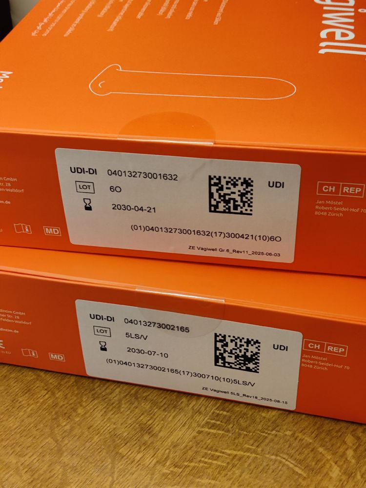 Photo of 2 thin orange boxes from Vagiwell. One is for the Vagiwell 5LS, the other for 6.