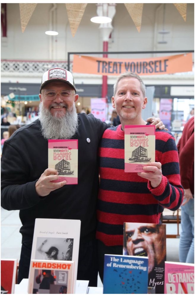 Me and the Bearded Badger holding up copies of Seven Nights at the Flamingo Hotel 