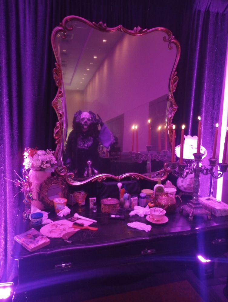 The aforementioned cosplayer looks into the same mirror that was used in the rite here rigte now Ghost movie.