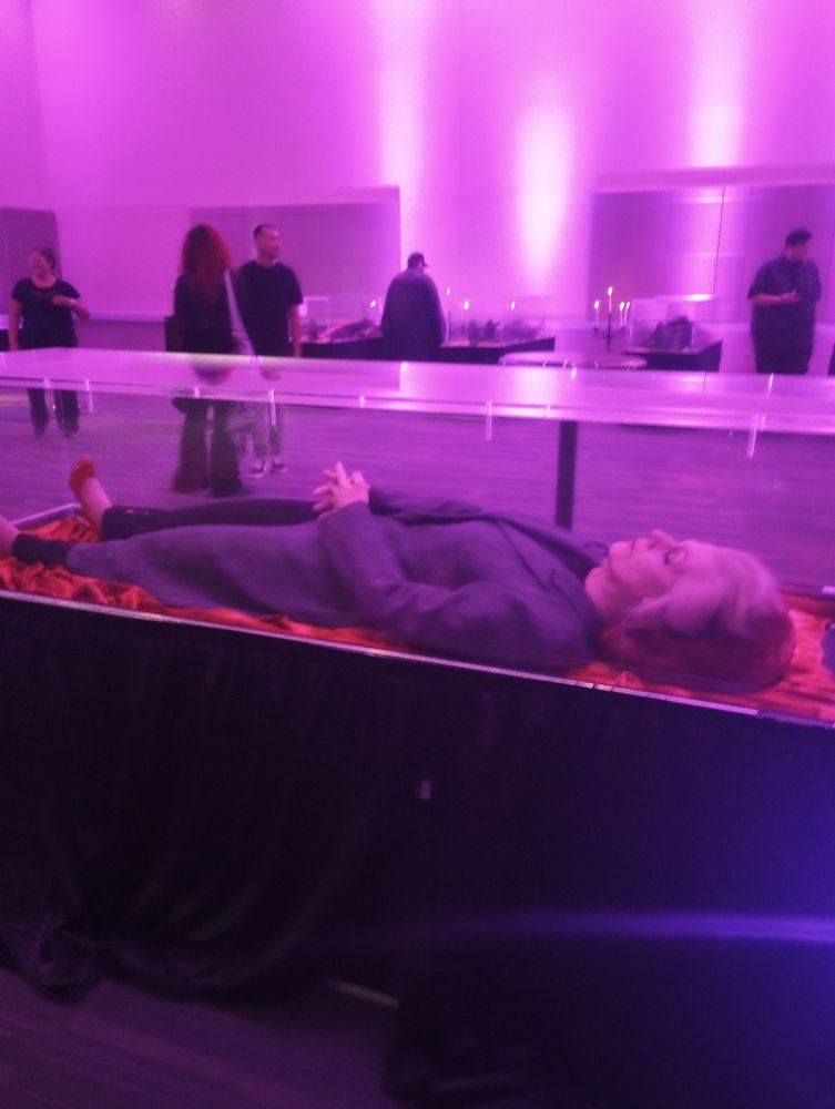 A mannequin of sister Emperator lies in rest under a glass coffin