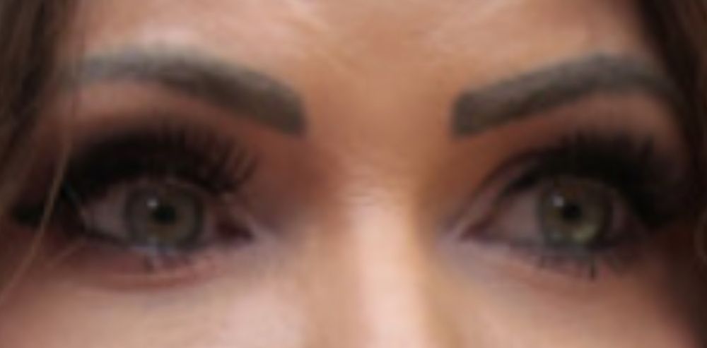 Kristi Noem’s weird painted eyebrows.