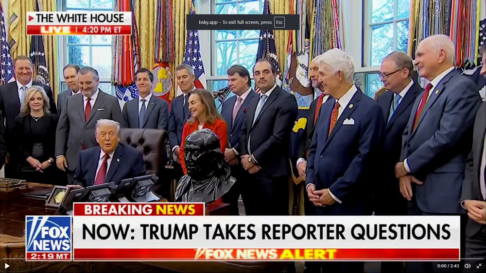 Racists standing around Trump and laughing while he bashes Somalians.