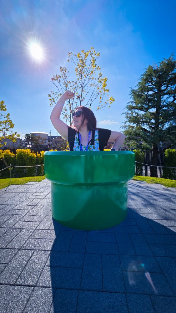 Photo of me popping out of a warp pipe outside the Nintendo Museum