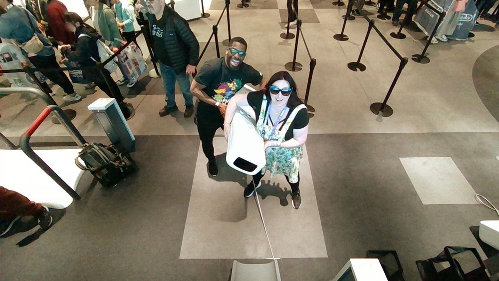 Photo of Inel and I playing with a massive Wii controller