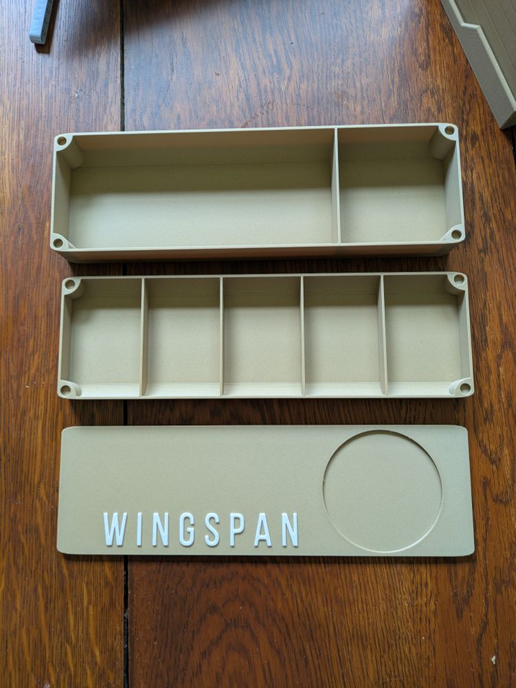 A 3D-printed storage box, in three pieces, for the board game Wingspan.