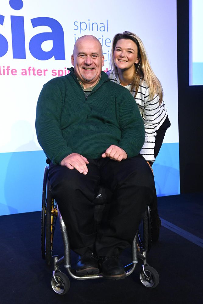 Hosts Simon and Lois posing for a photo