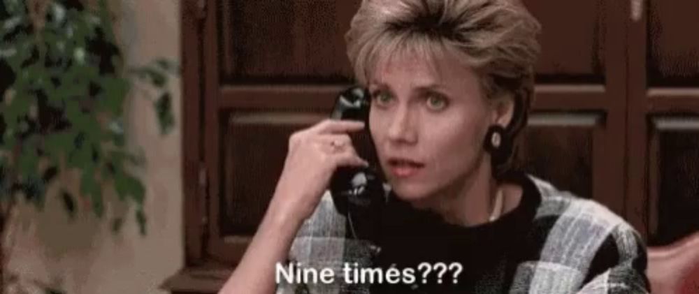 a woman is talking on a cell phone and says nine times ?