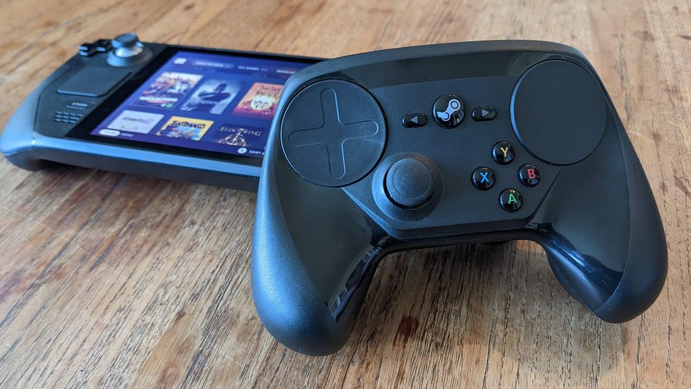 The Steam Controller, pictured nicely next to a Steam Deck. 
