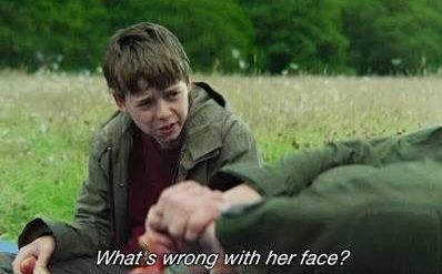 A boy asking what's wrong with her face