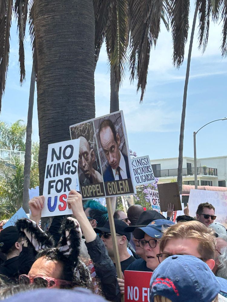 No Kings protest signs. Gollum and Stephen Miller.