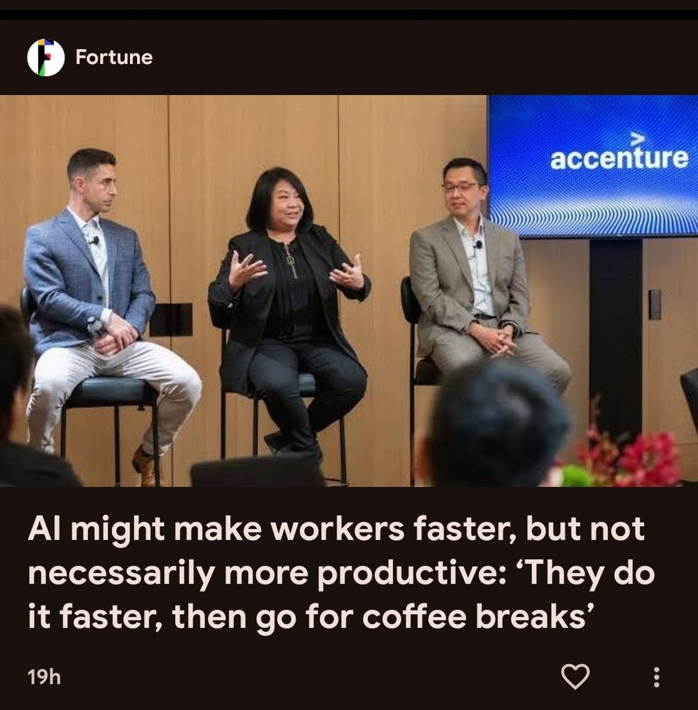 Screenshot of a news headline saying "AI might make workers faster, but not necessarily more productive: 'They do it faster then go for coffee breaks'". Above the headline is an image of 3 people on a stage in what looks like a conference setting.