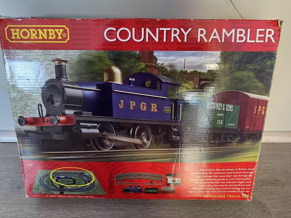 Picture of Hornby Country Rambler train set box lid with Blue tank engine, green wagon R Starkey and sons and freight van JPG