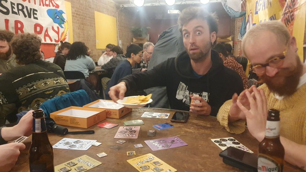 Games Transformed organisers playing Billionaires and Guillotines. They are drunk.