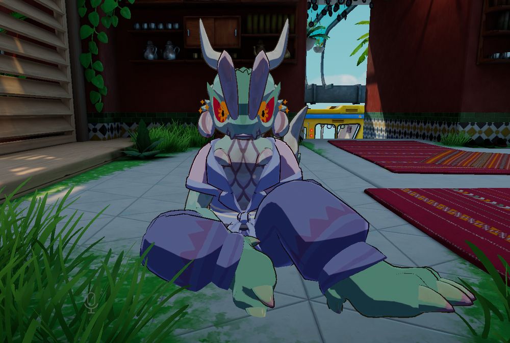 A screenshot of a VRChat avatar, a green centipede-like anthro with floral red-orange eyes and patterns reminiscent of succulent plants. Xe is wearing an open pastel shirt and blue jeans, and is seated on the ground in a partially overgrown structure.