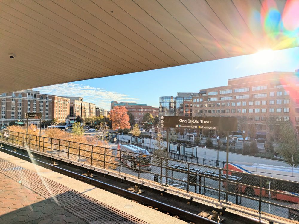 View from the King St Metro platform, sun shining brightly in a blue sky.