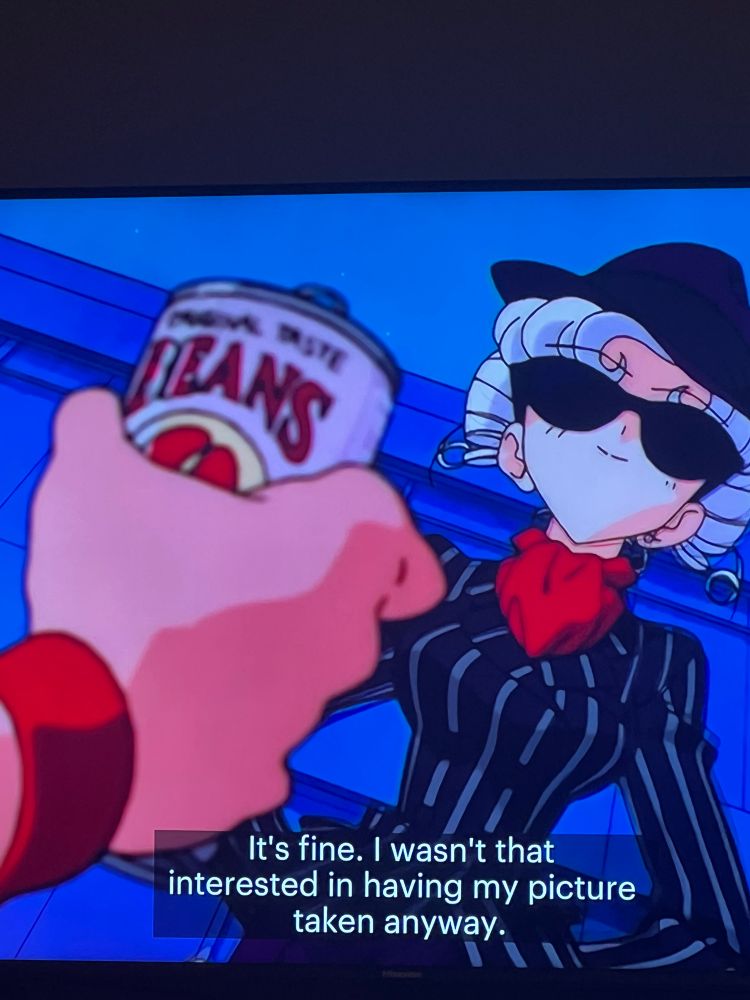 Picture from Sailor Moon Stars with iron mouse saying “It's fine. I wasn't that interested in having my picture taken anyway.” The photographer is holding a can saying “original taste: BEANS”