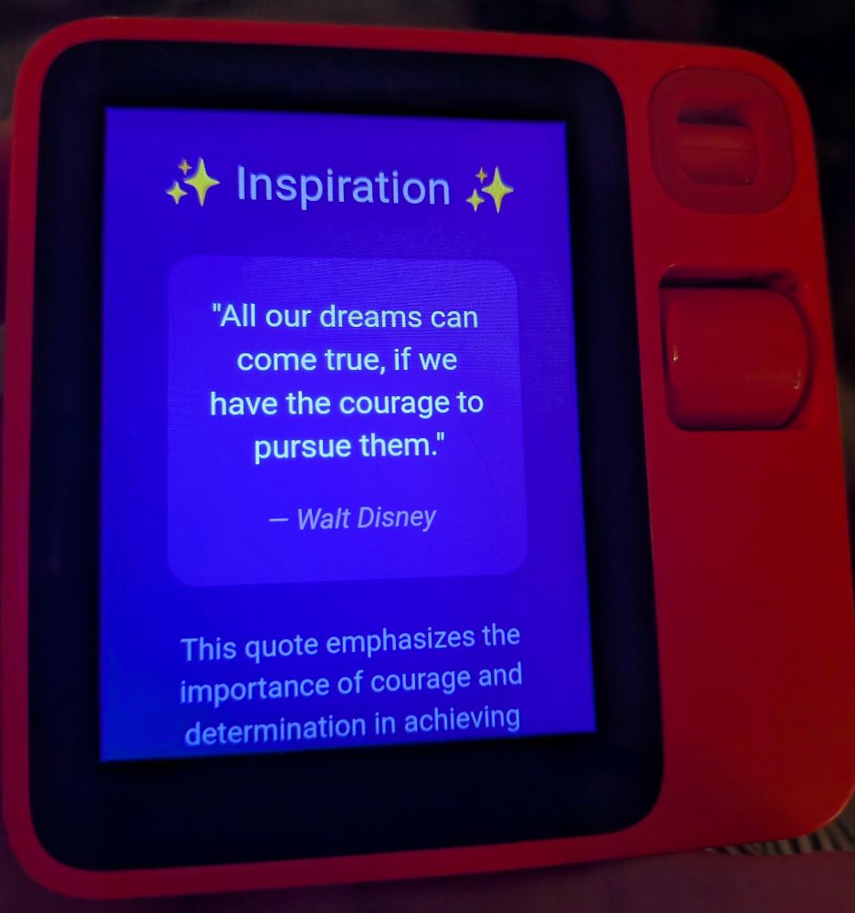 rabbit r1 AI device showing a purple generated UI with stars and a motivational quote from Walt Disney saying "All our dreams can come true, if we have the courage to pursue them" 