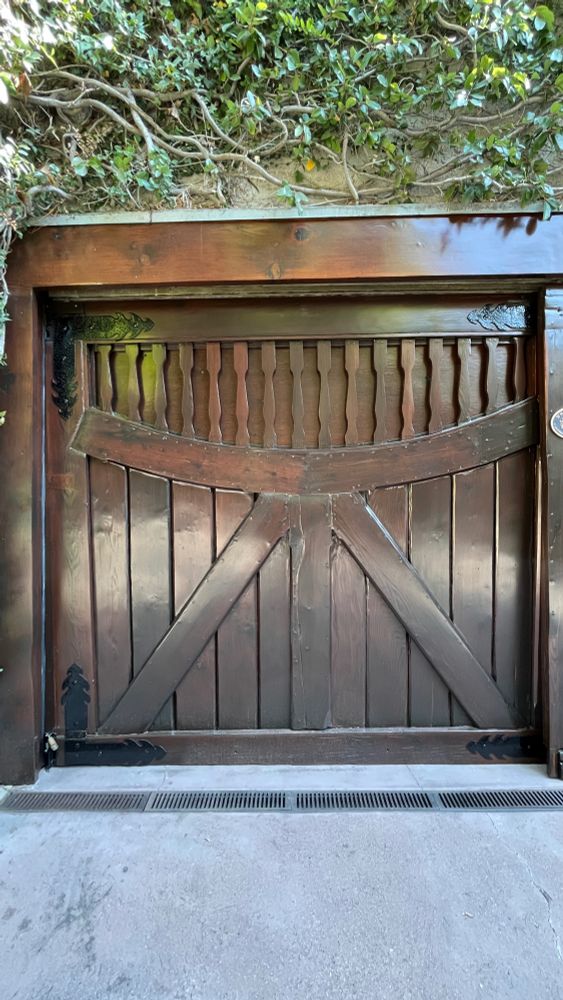 Close up of one of the completed barn doors. The black metal brackets and door backs have been installed.  This door is done!