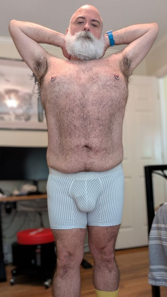 Man in tight underwear bulge visible arms up pits showing 