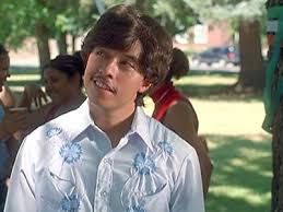 Pedro in Napoleon Dynamite looking up sideways with a little smile, because his dream of becoming class president has come true