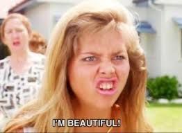 Mean girl in Muriels Wedding pulling an ugly face while screeching I'm beautiful!