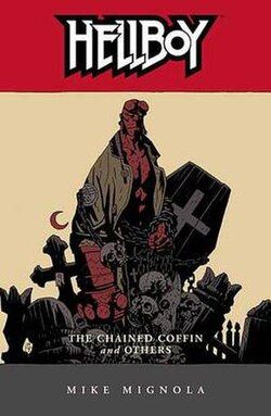 The cover for the trade paperback Hellboy: The Chained Coffin and Others, featuring an illustration of Hellboy and the coffin front and center.