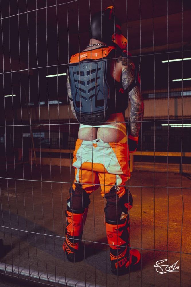 Human pup in MX gear with butt out.