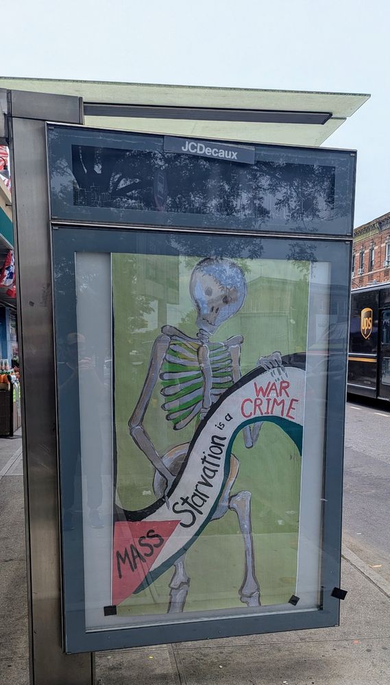 Starvation is a war crime poster on a bus stop in Kensington, Brooklyn 