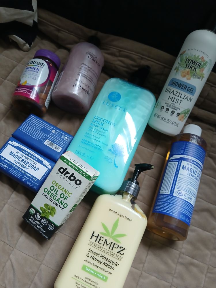 An assortment of health and hygiene products including soaps and vitamins