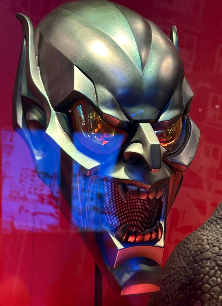 The Green Goblin mask from Sam Raimi’s Spider-Man (2002) movie in a glass case