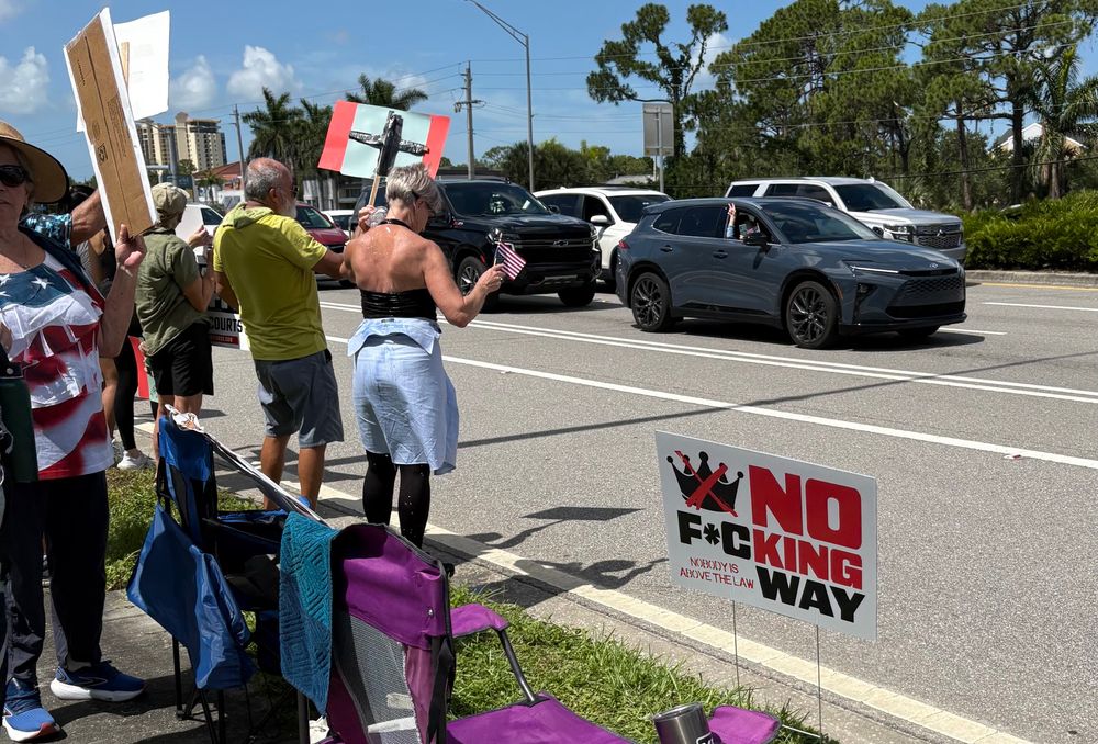 Protestors in Lee County Florida. Cars honking support was CONSTANT.