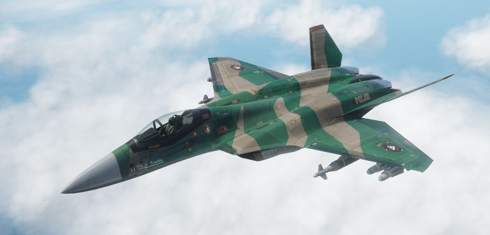 Twin-Engine 5th Generation Fighterjet from Nuclear Option, the Ifrit. Carrying a varied loadout under its wings, and painted in a dark-sandy/foilage green angular camo pattern, with "Viva la Primeva" in white stencil next to the canopy.