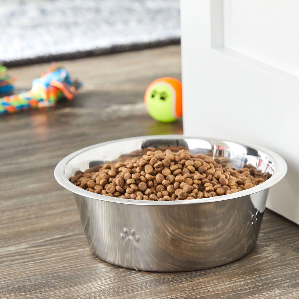 A bowl with dog food in it.