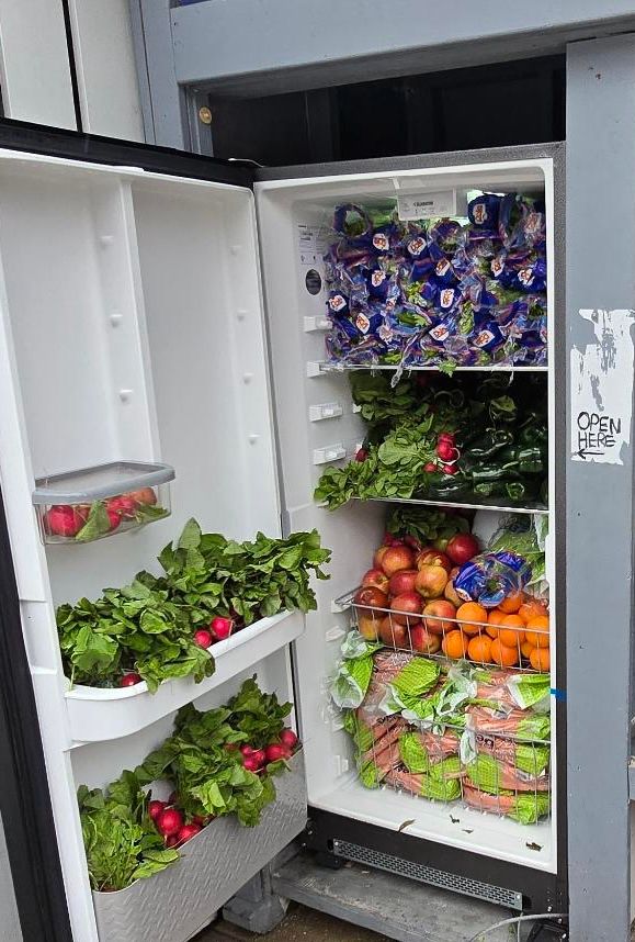 A refrigerator filled with various fruits & veggies.