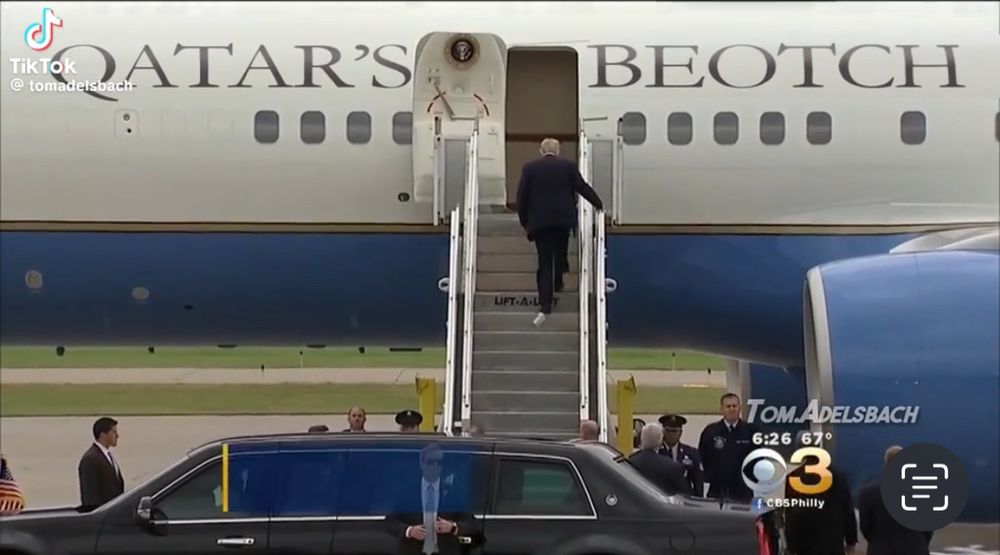President Trump climbing the stairs of “Qatar’s Beotch,” the plane given to the United States as a gift from Qatar. Trump is seen climbing the stairs with toilet paper stuck to his shoe. 