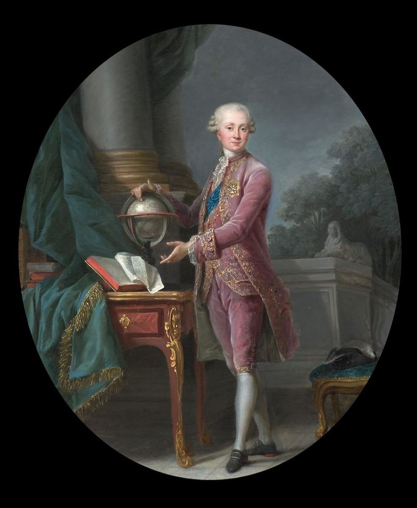 Elisabeth Louise Vigée Le Brun’s 1776 oval oil portrait of Karl Heinrich, Prince of Nassau-Siegen. He stands in a richly embroidered pink suit and white stockings, one hand resting on a gilded rococo desk and the other pointing to a globe. A classical column and garden foliage form the background, all framed by the oval composition.