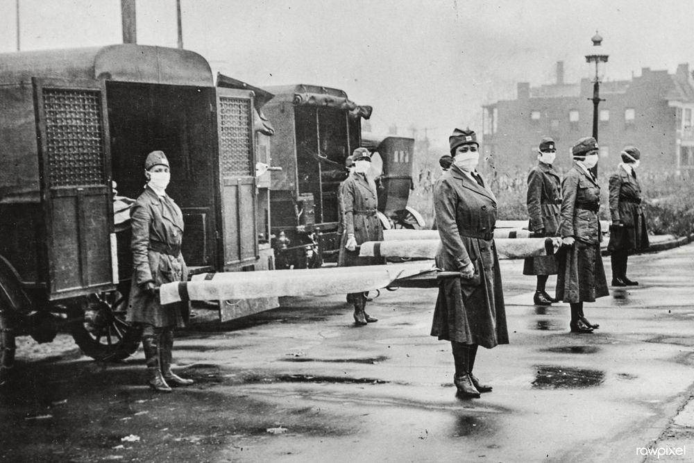 Photograph of health military staff, holding stretchers at the back of trucks. St. Louis Red Cross Motor Corps on duty during influenza epidemic (1918). Original from Library of Congress. Digitally enhanced by rawpixel. Under a CC-BY 4.0 license: https://bit.ly/3WfaQFg 