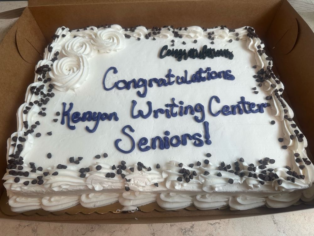 The image shows a cake that has frosting writing which reads congratulations Kenyon writing Center seniors