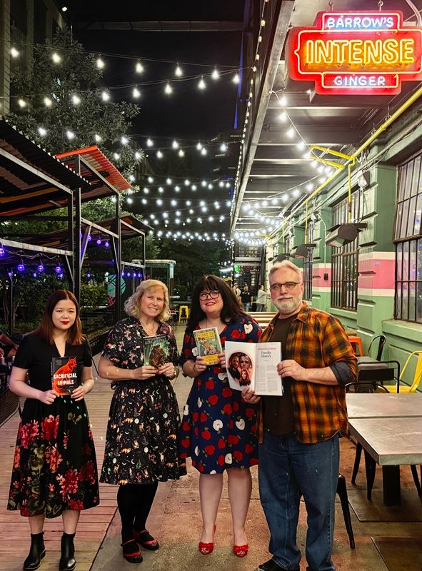 Kailee Pedersen, Randee Dawn, Liz Gotauco and David Mack hold their books and stories outside Barrow's Intense Ginger Tasting room in Brooklyn after September 17th's Brooklyn Books & Booze reading