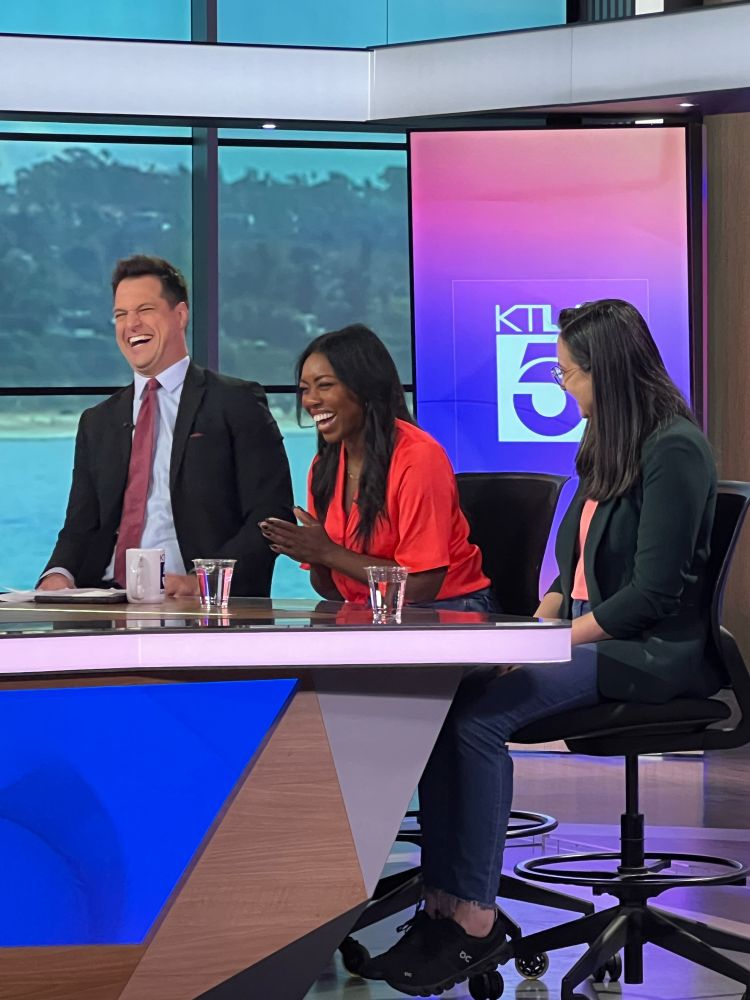 Entertainment reporter Doug Kolk and Ashleigh laughing during the interview as I look on, presumably also smiling but you can’t see my face.