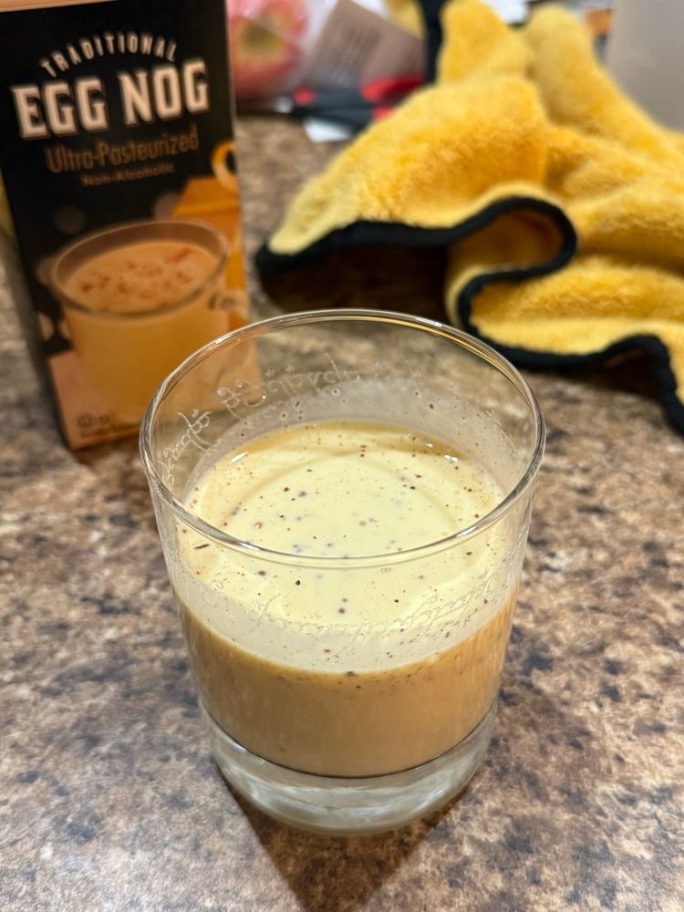 A nice glass of nog. There’s a towel in the background 