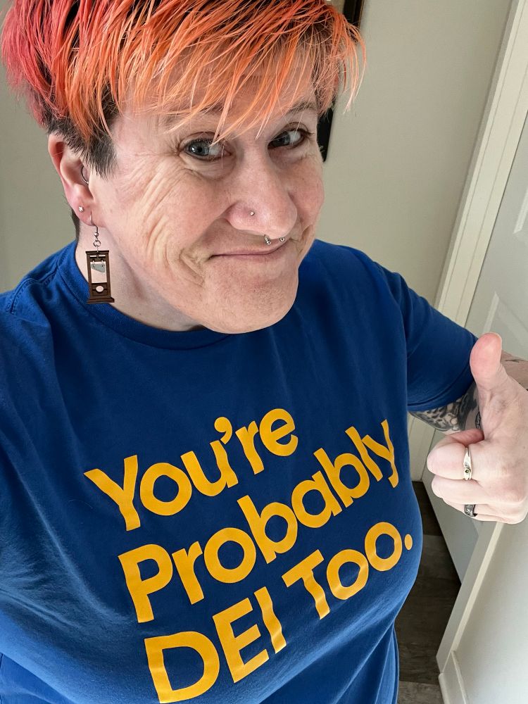 Woman wearing shirt with text that reads You’re Probably DEI Too.