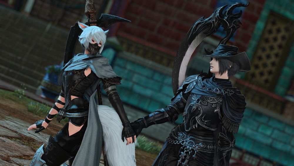 A screenshot of the game FFXIV. It depicts Nelo, a feminine looking Miqo'te, and their partner the NPC Zero from Endwalker. They are holding hands and walking through Radz-at-Han together, with Nelo leading them around. 

Nelo has short dove blue hair, and is wearing a mask over their mouth and nose that is black and metallic. They are wearing the reaper artifact gear for Endwalker, dyed ice blue. There is a scythe on their back.