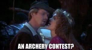 A frame from Robin Hood: Men in Tights where Robin (played by Cary Elwes) has just interrupted a kiss with Maid Marian (played by Amy Yasbeck) to ask "An archery contest?"