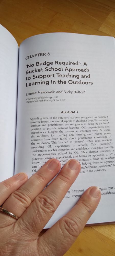 Book open at the start of our chapter. The chapter is titled "'No Badge Required': A Bucket School Approach to Support Teaching and Learning in the Outdoors"
