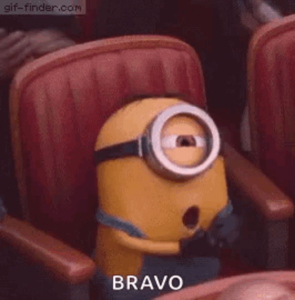 a minion is sitting in a chair with his mouth open and the word bravo written on it .