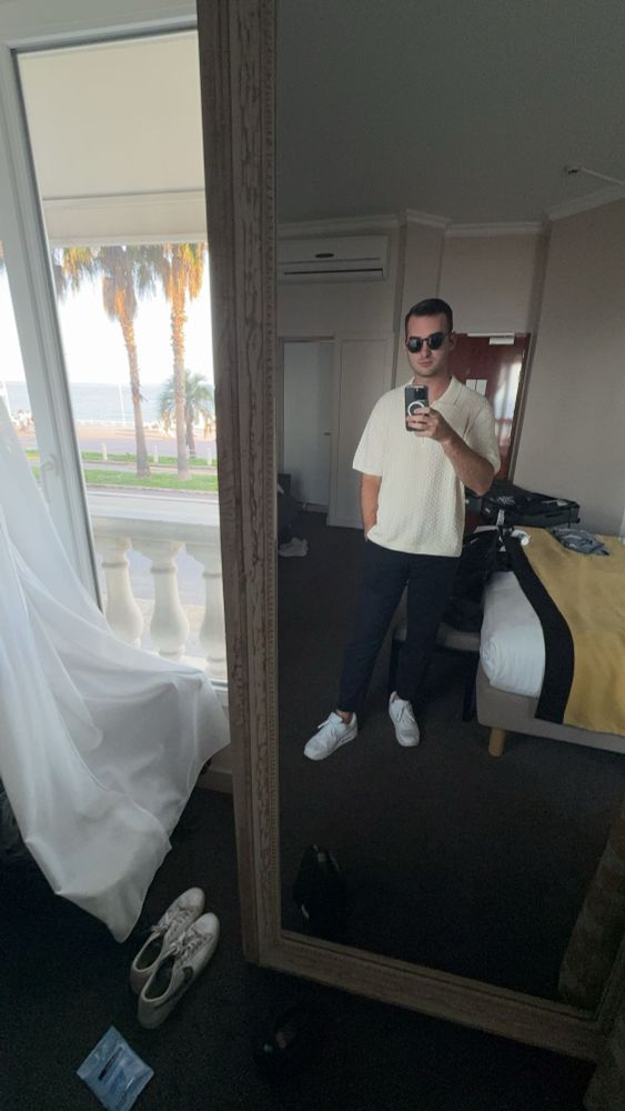 me showing off the fit with a coast of France in the background 