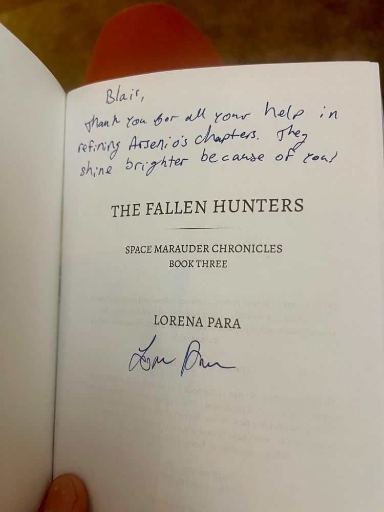 The opening page for “the fallen hunters” by Lorena para. There is a hand written note that says “Blair, thank you for Al your help in refining Arsenio’s chapters. They shine brighter because of you!” And then her signature at the bottom 