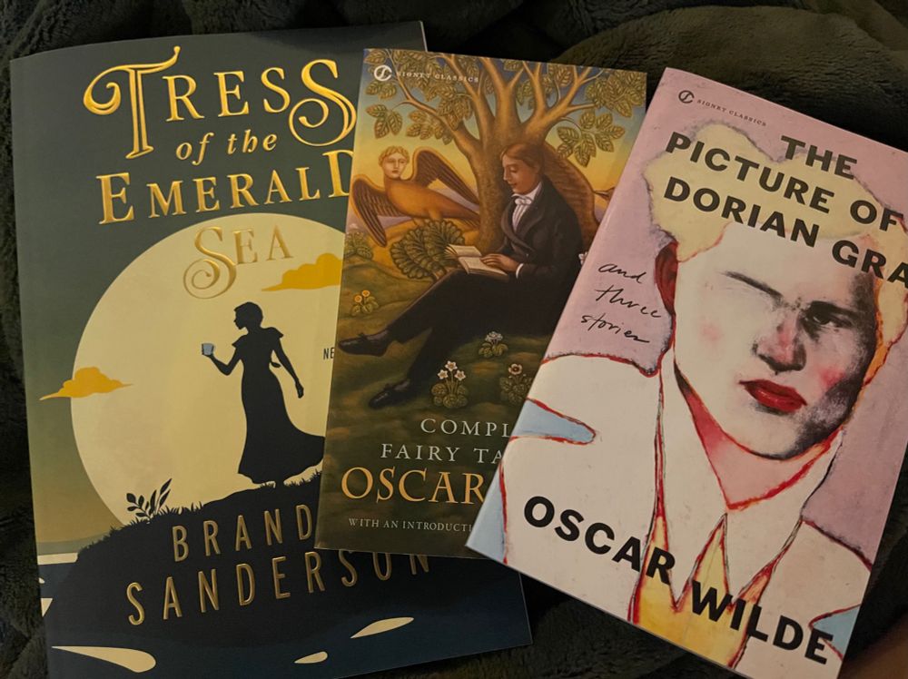 Three books. 
“Trees of the emerald sea” by Brandon Sanderson 
“Complete fairytales of Oscar Wilde”
“The picture of Dorian gray” by Oscar Wilde. 