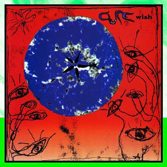 The cover of the album wish by the Cure. Blue circle on red background with doodled eyes